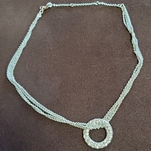 Silver-toned formal necklace.